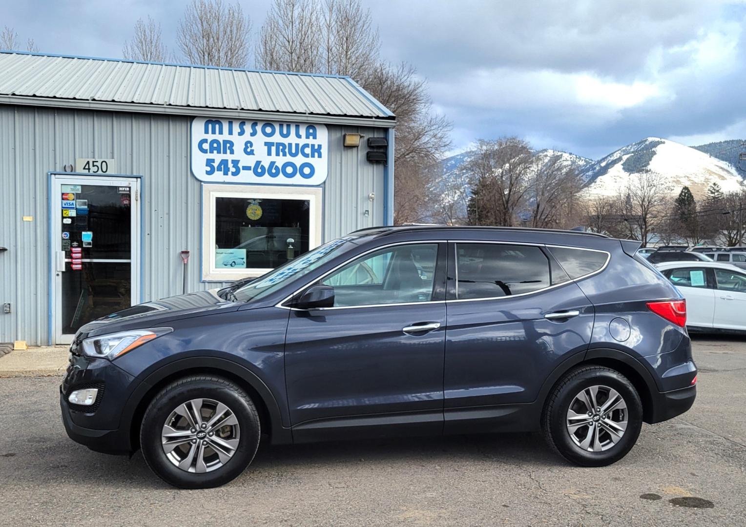 2016 Blue /Tan Hyundai Santa Fe Sport (5XYZUDLB6GG) with an 2.4L I4 engine, 6 Speed Automatic transmission, located at 450 N Russell, Missoula, MT, 59801, (406) 543-6600, 46.874496, -114.017433 - One Owner. Clean Carfax. Heated Seats. Towing. Air. Cruise. Tilt. Backup Camera. Power Windows and Locks. AM FM Bluetooth. - Photo#0